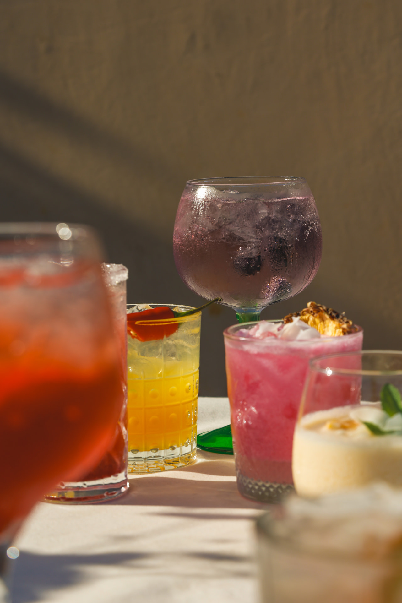 Colourful cocktails on a table at the Nōesis bar