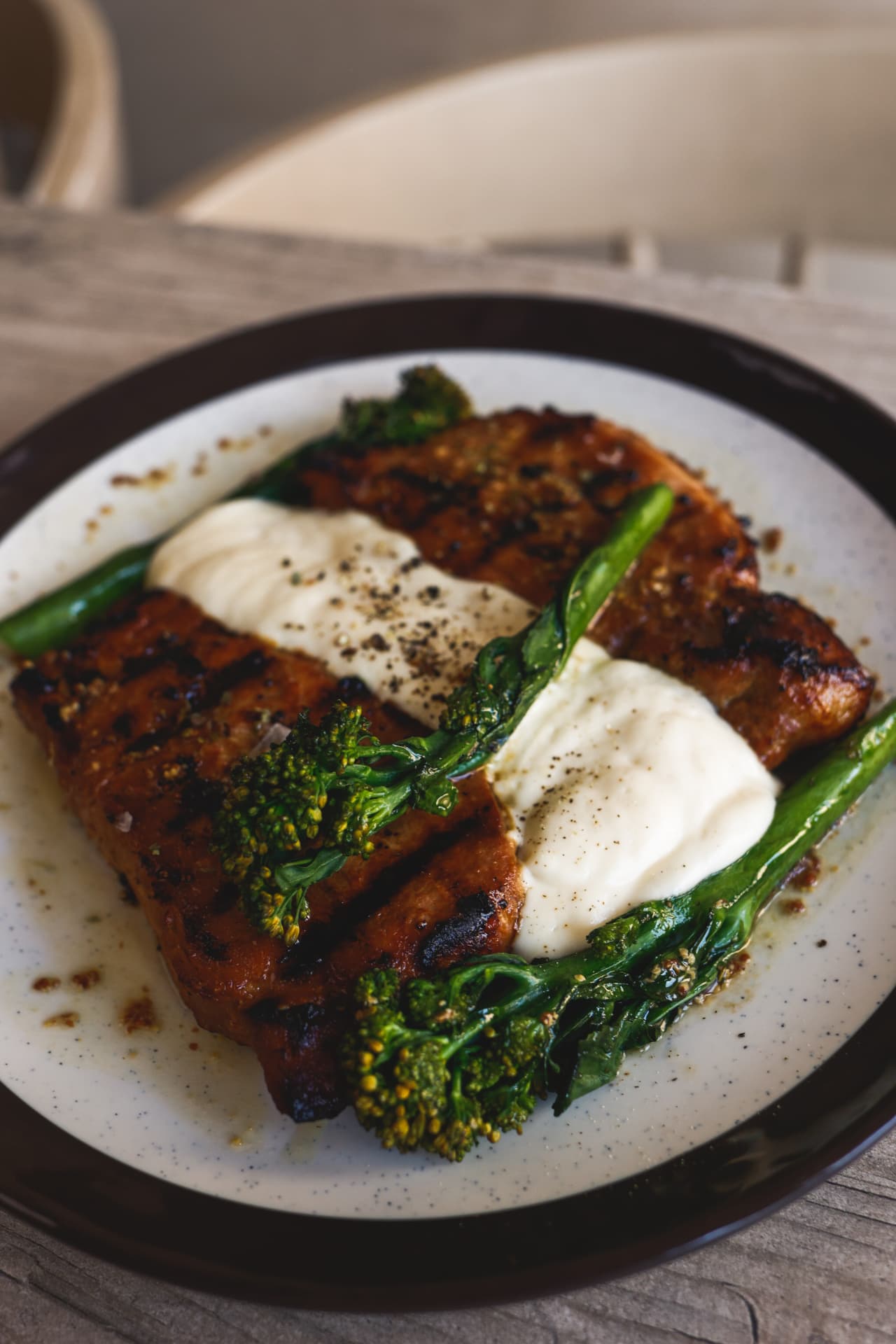 Grilled meat with a creamy sauce and broccolini at Nōesis