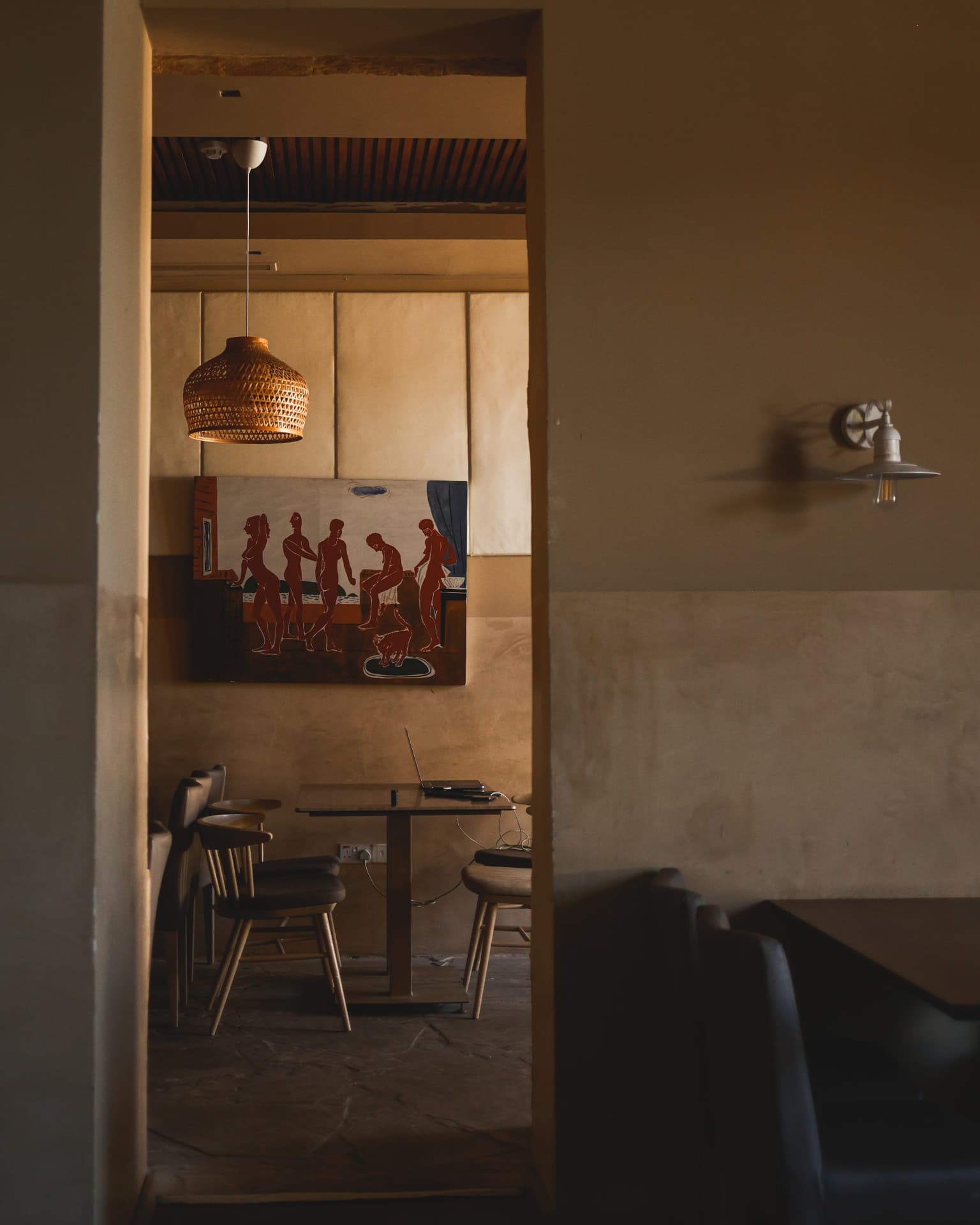 Warmly lit tables inside Nōesis